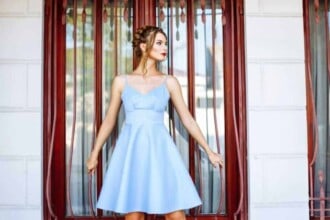 cheerful girl blue dress with red lips stylish hairdo