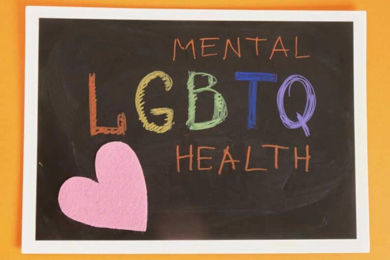 coloful inscription mental lgbtq health black chalkboard orange background pride concept