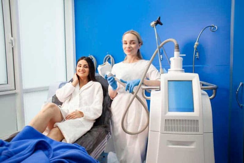 coolsculpting procedure cosmetology clinic cosmetologist doctor with modern fat removal equipment