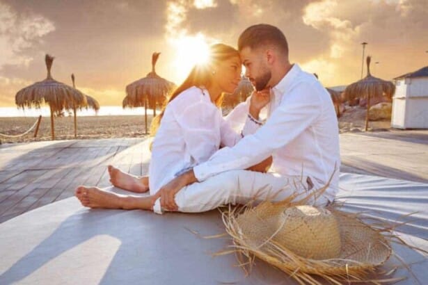 couple young beach vacation sunrise