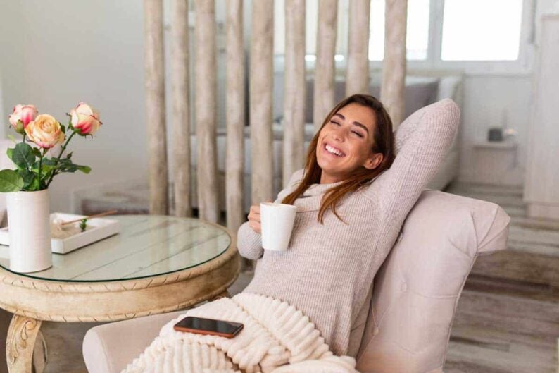 cup tea coffee chill woman lying couch drinking hot coffee enjoying morning being dreamy relaxed mood girl covered blanket takes break home