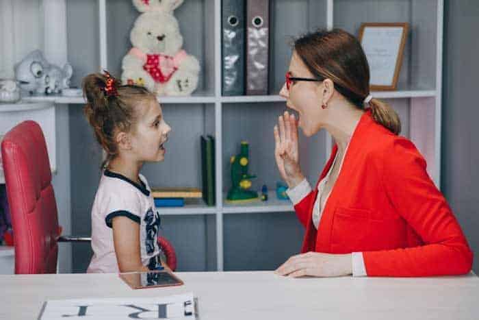 cute little girl speech therapist s office