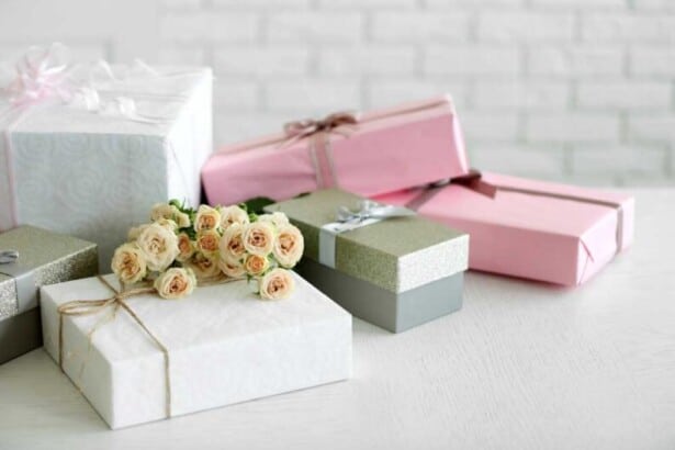 decorated gift boxes bouquet roses white brick wall background