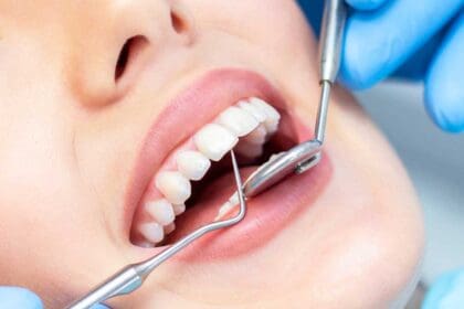female dentist teeth examination