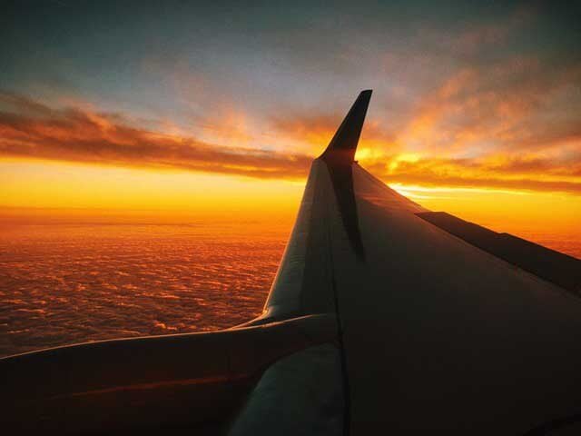 flight sunset red clouds 1 1