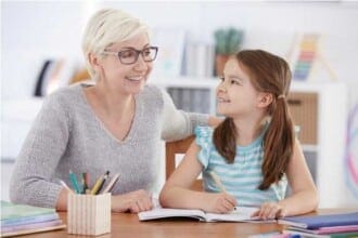 girl doing homework with tutor