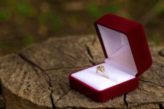 gold ring red box stump wedding concept