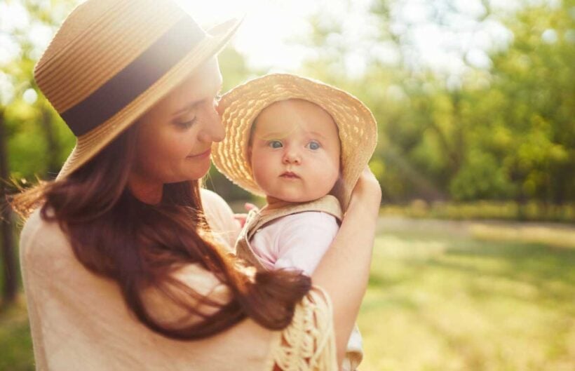 happy stylish loving family mother playing with her baby outdoor lovely baby smiles enjoys mother s day concept
