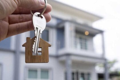 landlord unlocks house key new home real estate agents sales agents 1