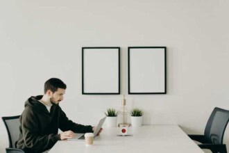 man in black long sleeve shirt sitting at table 4064828