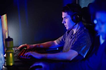 man playing video games neon light