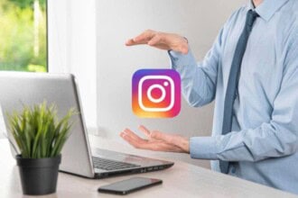 onok ukraine july 14 2021 businessman holds clicks instagram icon his hands social network global network data customer connection international network