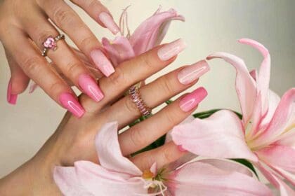 pink elongated nail extension with fine glitter