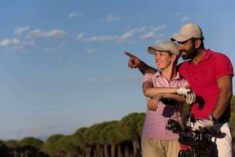 portrait happy young couple golf course