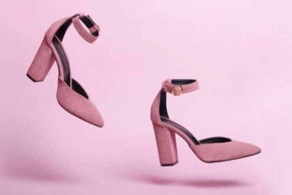 running female pink high heel shoes isolated pink background fashion shoes photo motion