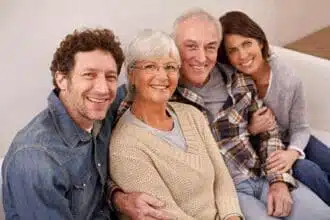 spending time with mom dad portrait happy mature parents sitting with their adult children home