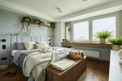stylish bedroom interior modern apartment with small bed wooden chest home garden white bedding pillows blanket sunny space with grey walls brown wooden parquet template