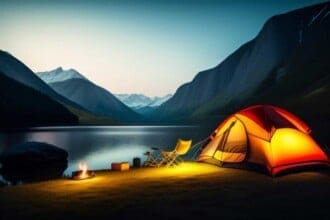 tent by lake with mountain background