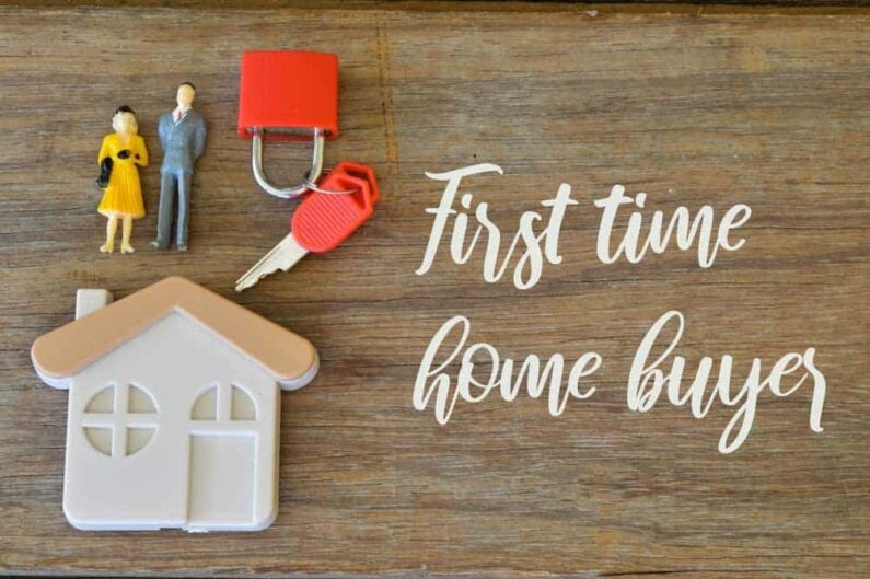 wooden background written with first time home buyer
