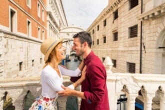 young couple having fun while visiting venice tourists travelling italy sightseeing most relevant landmarks venezia concepts about lifestyle travel tourism