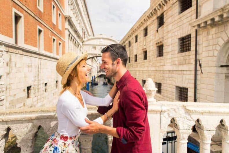 young couple having fun while visiting venice tourists travelling italy sightseeing most relevant landmarks venezia concepts about lifestyle travel tourism