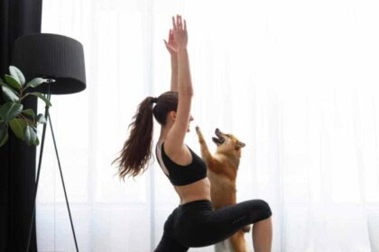 young woman exercising with her dog