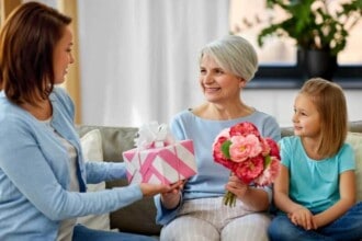 family giving present to grandmother