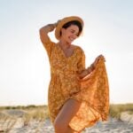 stylish attractive slim smiling woman on beach in summer style fashion trend outfit